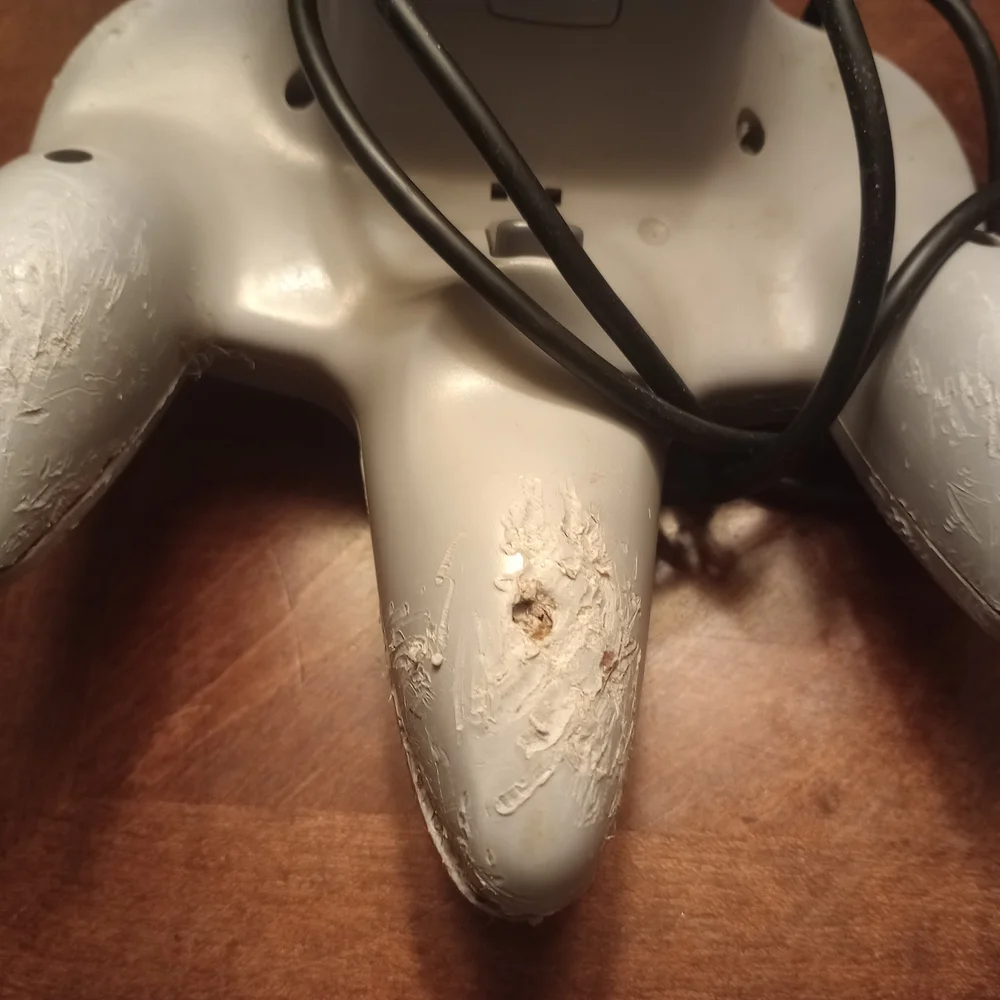 Gray and Pink Video Game Controllers